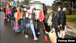 Thirteen North Korean workers who escaped an overseas North Korea restaurant and arrived in Seoul on April 7. South Korea's Unification Ministry announced several defections recently.