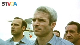 This still from video obtained exclusively by Associated Press shows then-prisoner of war John McCain, standing with other POWs as they were released by the North Vietnamese in Hanoi on March 14, 1973.