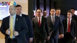 U.S. Treasury Secretary Steven Mnuchin (C) and the U.S. delegation for trade talks with China, leave a hotel in Beijing, China May 3, 2018. Talks between U.S. and Chinese officials have not yet restarted.