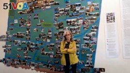 Judy Branfman stands by a map she created as part of a gallery installation at Beyond Baroque Gallery on Nov. 3, 2023, in the Venice Beach area of Los Angeles. (AP Photo/Richard Vogel)