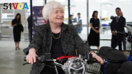 U.S. Treasury Secretary Janet Yellen sits on a scooter while visiting a factory assembling electric scooters in Hanoi, Vietnam on Thursday, July 20, 2023. (AP Photo/Hau Dinh)