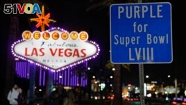 The Welcome to Las Vegas is outlined in purple for the Super Bowl, Feb. 6, 2024, in Las Vegas. On Sunday, the city will host the Kansas City Chiefs and the San Francisco 49ers in Super Bowl 58. (AP Photo/Charlie Riedel)