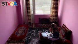 Sofia, an Afghan student, speaks English during an online class, at her house in Kabul, Afghanistan, March 18, 2023. (REUTERS/Sayed Hassib)