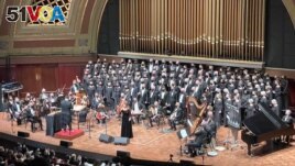 The National Arab Orchestra (NAO)performs onstage with supporting chorus. (Courtesy NAO/David Schall)