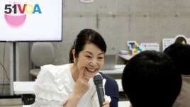 FILE - Smile coach Keiko Kawano teaches students at a smile training course at Sokei Art School in Tokyo, Japan, May 30, 2023. REUTERS/Kim Kyung-Hoon 