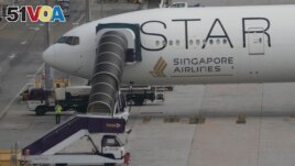 The Boeing 777-300ER aircraft of Singapore Airlines is parked at Suvarnabhumi International Airport, near Bangkok, Thailand, May 22, 2024. The plane dropped around 1,800 meters in about three minutes after hitting severe turbulence over the Indian Ocean. (AP Photo/Sakchai Lalit)