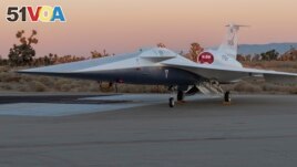 NASA's X-59 supersonic research aircraft sits outside Lockheed Martin's Skunk Works facility in Palmdale, California. (Image Credit: NASA Lockheed Martin Skunk Works)