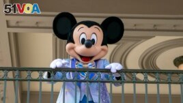 FILE - An actor dresses as Mickey Mouse at Walt Disney World Resort, April 18, 2022, in Florida. The earliest version of Disney's most famous character will become public domain on Jan. 1, 2024. (AP Photo/Ted Shaffrey, File)