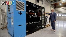 Zenobe's Founder Director Steven Meersman shows off one of the company's second-life battery energy storage units at the startup's innovation centre in Portsmouth, Britain February 20, 2023. (REUTERS/Nick Carey)