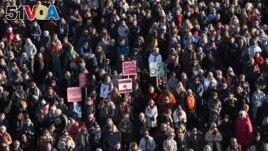People across Iceland gather during the women's strike in Reykjavik, Iceland, Tuesday, Oct. 24, 2023. (AP Photo/Arni Torfason)