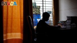 Sheikh Tamim Hasan, 13, a student of class seven, studies in his room as authorities decided to close schools during countrywide heatwave in Dhaka, Bangladesh, April 30, 2024. (REUTERS/Mohammad Ponir Hossain)