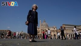 Sister Nathalie Becquart, the first female undersecretary in the Vatican's Synod of Bishops, poses for a photo in front of St. Peter's Square, Monday, May 29, 2023. (AP Photo/Alessandra Tarantino)
