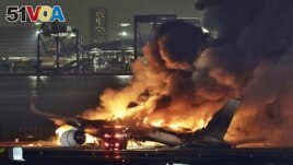 A Japan Airlines plane is on fire on the runway of Haneda airport on Tuesday, Jan. 2, 2024 in Tokyo, Japan. 