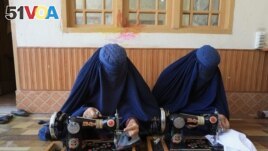 Afghan women attend tailoring class at the Skills Academy for Needy Aspirants (SANA) in Peshawar, Pakistan July 13, 2023. (REUTERS/Fayaz Aziz)