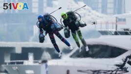 Jet suit pilots race in Dubai, United Arab Emirates, Wednesday, Feb. 28, 2024. Dubai on Wednesday hosted what it called its first-ever jet suit race. (AP Photo/Jon Gambrell)