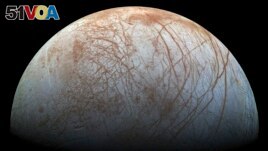 This image made available by NASA in 2014 shows Jupiter's icy moon Europa in a reprocessed color view, made from images captured by NASA's Galileo spacecraft in the late 1990s. (NASA/JPL-Caltech/SETI Institute via AP)