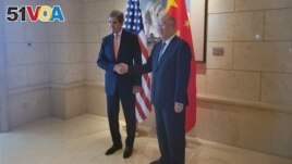 U.S. Special Presidential Envoy for Climate John Kerry shakes hands with his Chinese counterpart Xie Zhenhua before a meeting in Beijing, China July 17, 2023. (REUTERS/Valerie Volcovici)