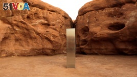 A metal monolith is seen in Red Rock Desert, Utah, U.S., November 25, 2020, in this still image obtained from a social media video. @davidsurber_ via REUTERS