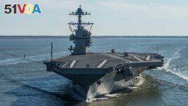FILE - In this April 8, 2017 photo provided by the U.S. Navy, the USS Gerald R. Ford sails on the first of its sea trials to test various state-of-the-art systems on its own power for the first time, from Newport News, Va. 