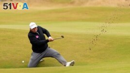 FILE - England's Marcus Armitage plays out of a bunker on the 14th during the second round at the 150th Open Championship, in St Andrews, Scotland on July 15, 2022. (REUTERS/Phil Noble)
