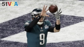 Nick Foles catches a pass for a touchdown against the New England Patriots in a trick play