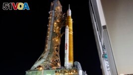 The NASA Artemis rocket with the Orion spacecraft aboard leaves the Vehicle Assembly Building moving slowly to pad 39B at the Kennedy Space Center in Cape Canaveral, Fla., Tuesday, Aug. 16, 2022. (AP Photo/Terry Renna)