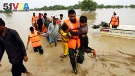 Army troops rescue people from a flood-hit area in Rajanpur, district of Punjab, Pakistan, August 27, 2022.(AP Photo/Asim Tanveer)