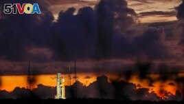 The NASA moon rocket stands ready at sunrise on Pad 39B before the Artemis 1 mission to orbit the moon at the Kennedy Space Center, Monday, Aug. 29, 2022, in Cape Canaveral, Fla. (AP Photo/Brynn Anderson)