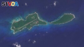 This image provided by Planet Labs PBC shows Islas del Cisne in Honduras, on July 13, 2023. Honduras says it will build a maximum security prison on this tiny island off its Caribbean coast to contain the country's most dangerous criminals.(Planet Labs PBC via AP)