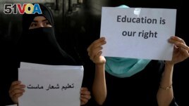 Afghan girls hold illegal protest to demand the right to education in a private home in Kabul, Afghanistan, Tuesday, Aug. 2, 2022. (AP Photo/Ebrahim Noroozi)