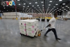 FILE - Boxes containing the Moderna COVID-19 vaccine are prepared to be shipped at the McKesson distribution center in Olive Branch, Mississippi, U.S. December 20, 2020. (Paul Sancya/Pool via REUTERS/File Photo/File Photo)