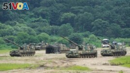 South Korean army K-9 self-propelled howitzers take positions in Paju, near the border with North Korea, South Korea, Monday, Aug. 22, 2022. (AP Photo/Ahn Young-joon)