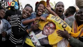 Supporters of Deputy President and presidential candidate William Ruto celebrate his victory over opposition leader Raila Odinga in Eldoret, Kenya, Aug. 15, 2022. (AP Photo/Brian Inganga)