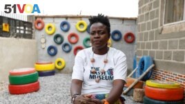 Jumoke Olowookere, founder of the Waste Museum, sits for a photograph after talking with Reuters at the museum in Ibadan, Nigeria on February 23, 2022. (REUTERS/Temilade Adelaja)