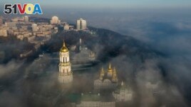 Morning fog surrounds the thousand-year-old Monastery of the Caves, also known as Kyiv-Pechersk Lavra, one of the holiest sites of Eastern Orthodox Christians, in Kyiv, Ukraine on Saturday, Nov. 10, 2018. (AP Photo/Evgeniy Maloletka, File)