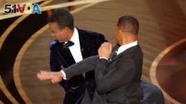 Will Smith hits at Chris Rock as Rock spoke on stage during the 94th Academy Awards in Hollywood, Los Angeles, California, U.S., March 27, 2022. (REUTERS/Brian Snyder)