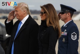 President-elect Donald Trump salutes as he and his wife Melania arrive at Andrews Air Force Base, Md., Thursday, Jan. 19, 2017, ahead of Friday's inauguration. (AP Photo/Evan Vucci)