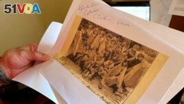 A copy of a late 19th century photograph of pupils at an Indigenous boarding school in Santa Fe, New Mexico. (AP Photo/Susan Montoya Bryan, File)