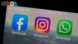 The mobile phone apps for, from left, Facebook, Instagram and WhatsApp are shown on a device in New York. (AP Photo/Richard Drew, File)