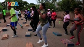 FILE - People exercise inside Warren Hills cemetery in Harare, Zimbabwe, November 24 ,2022. (REUTERS/Philimon Bulawayo)