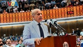 In this photo released by National Assembly of Pakistan, newly elected Pakistani Prime Minister Shahbaz Sharif addresses a National Assembly session, in Islamabad, Pakistan, Monday, April 11, 2022.