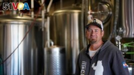 Eric Seufert, owner and manager of 105 West Brewing Co., poses for a photo at his brewery room Tuesday, Oct. 18, 2022, in Castle Rock, Colo. (AP Photo/Brittany Peterson)