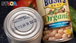 An expired best by date is seen on a can of garbanzo beans, Saturday, Aug. 20, 2022, in Boston, Massachusetts. (AP Photo/Michael Dwyer)