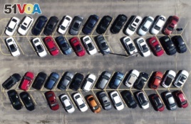 Cars are parked in an auto dealer lot Wednesday, April 15, 2020, in Green Park, Mo. U.S. retail sales recorded a record drop in March, with auto sales down 25.6%, as the coronavirus outbreak closed thousands of stores and shoppers stayed home.