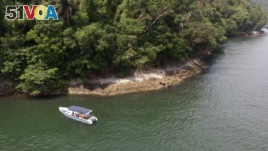 A boat belonging to Animal Heart Protectors is anchored off Furtada Island, popularly known as 