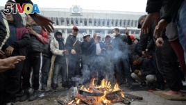 Protesters gather in front of the Kyrgyz government headquarters on the central square in Bishkek, Kyrgyzstan, Oct. 6, 2020. (AP)