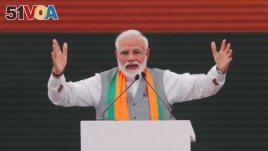 FILE - Indian Prime Minister Narendra Modi gestures as he speaks after releasing India's ruling Bharatiya Janata Party (BJP)'s election manifesto for the April/May general election, in New Delhi, Apr. 8, 2019.