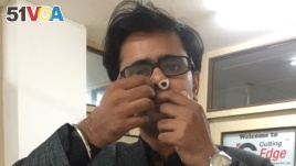 Prateek Sharma heads the New Delhi startup that produces the nose filters. He says they guard against air pollution and are comfortable to wear in the nose. (A. Pasricha/VOA, India, Jan 2018)