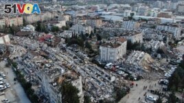 Aerial photo shows the destruction in Hatay city center, southern Turkey, Feb. 7, 2023. (IHA via AP)