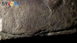 The runestone found at Tyrifjorden, Norway, is shown at the Museum of Cultural History in Oslo, Thursday, Jan. 12, 2023. (Javad Parsa/NTB Scanpix via AP)